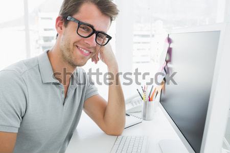 Geeky businessman using his laptop Stock photo © wavebreak_media