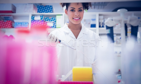 Pretty science student using pipette  Stock photo © wavebreak_media