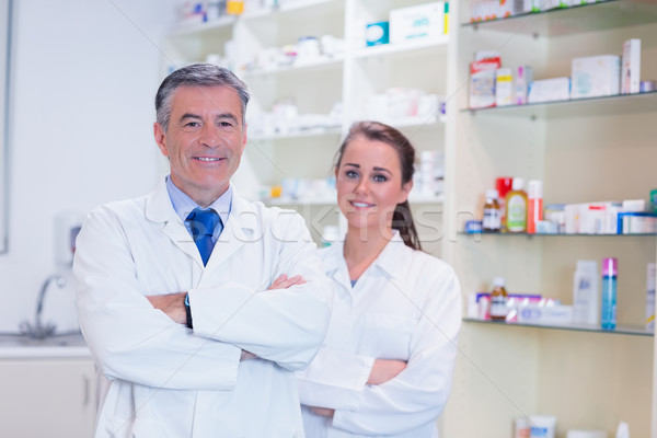 Pharmacist with his trainee standing with arms crossed Stock photo © wavebreak_media