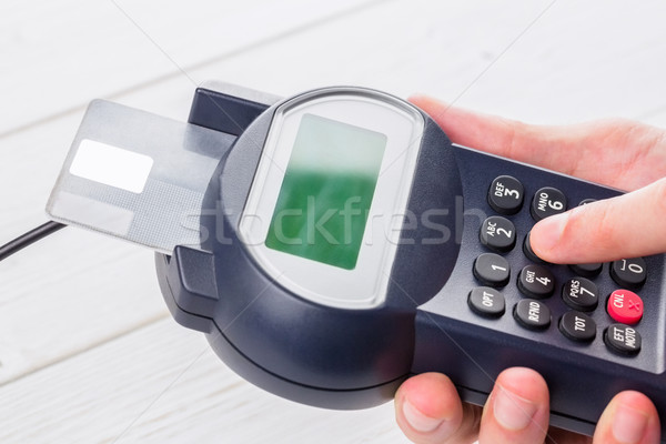 Man entering his pin on terminal Stock photo © wavebreak_media