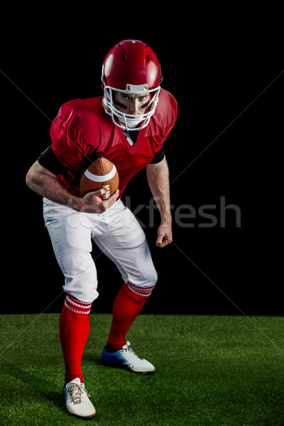 Portrait of focused american football player being ready to atta Stock photo © wavebreak_media