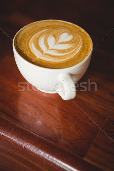 Cup of cappuccino with coffee art on the counter Stock photo © wavebreak_media