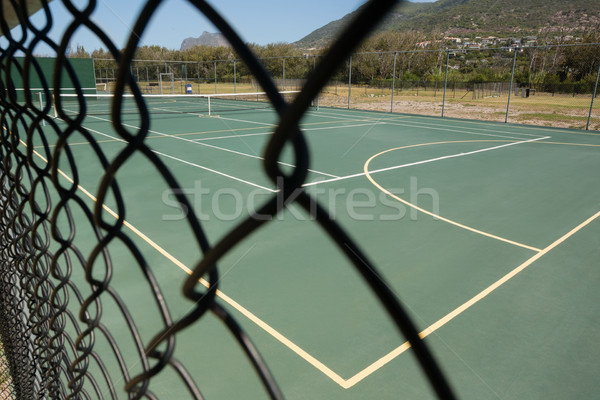 Empty tennis court seen through fence Stock photo © wavebreak_media