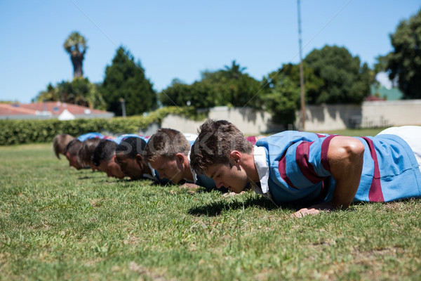 Close up of rugby players doing push up Stock photo © wavebreak_media