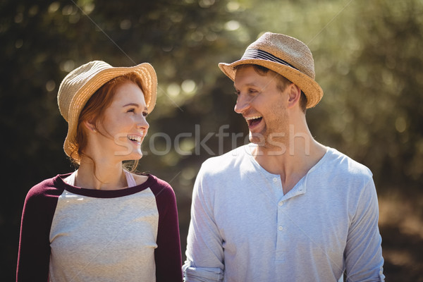 Cheerful young couple wearing hat on sunny day Stock photo © wavebreak_media