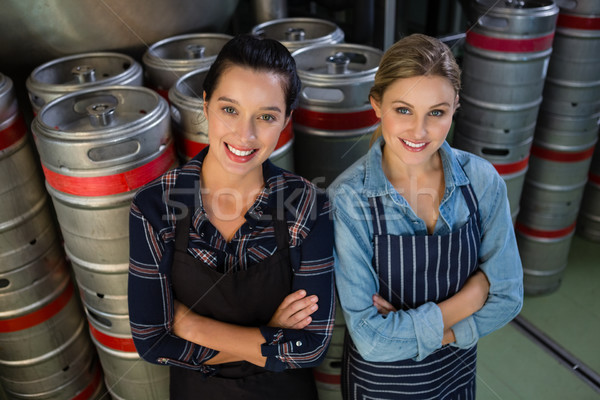 Portrait of smiling female coworkers with arms crossed Stock photo © wavebreak_media