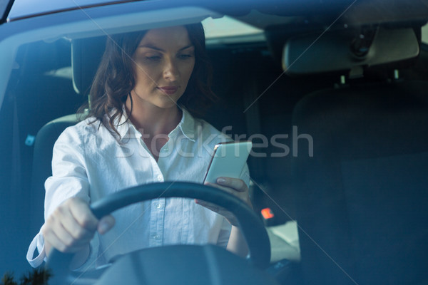 Femme téléphone portable conduite voiture belle femme Voyage [[stock_photo]] © wavebreak_media