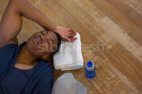 High angle view of male dancer sleeping on floor Stock photo © wavebreak_media