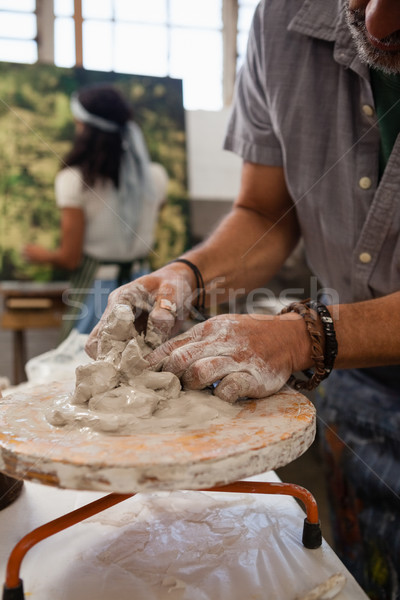 Mid section of man molding clay Stock photo © wavebreak_media