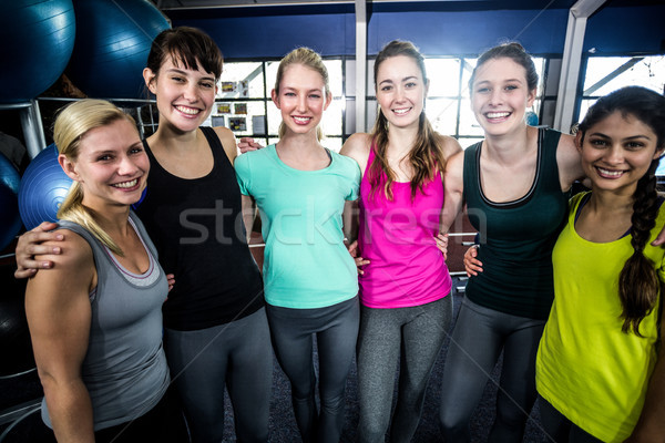 Sorridente grupo posando juntos ginásio Foto stock © wavebreak_media