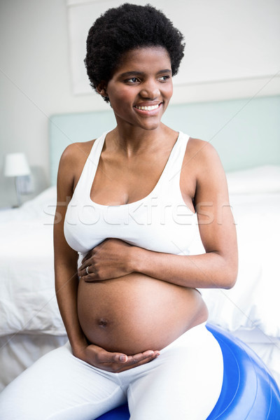 Mujer embarazada vientre sesión ejercicio pelota casa Foto stock © wavebreak_media
