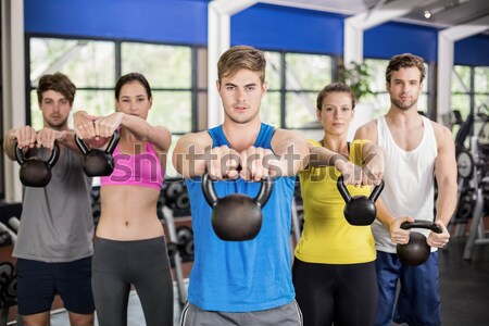 Athletic men and women working out  Stock photo © wavebreak_media