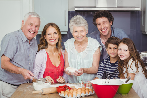 Portrait of happy family cooking food in kitchen Stock photo © wavebreak_media