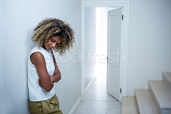 Stock photo: Tensed woman leaning on wall