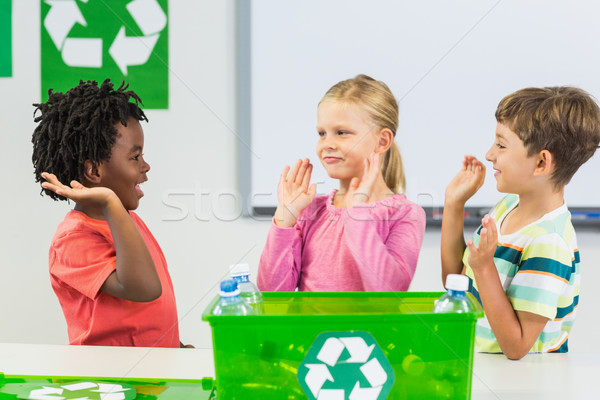 Kids giving high five to each other in classroom Stock photo © wavebreak_media