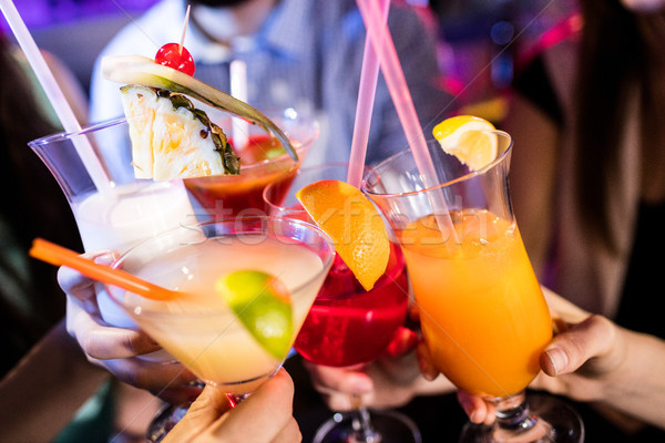 Group of friends toasting cocktail at bar counter Stock photo © wavebreak_media