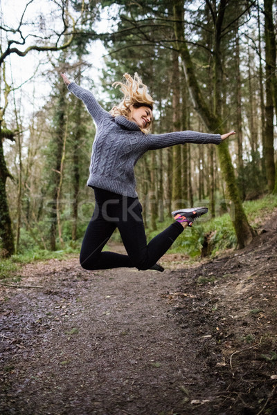 Güzel bir kadın atlama orman güzel gülümseyen kadın kadın Stok fotoğraf © wavebreak_media