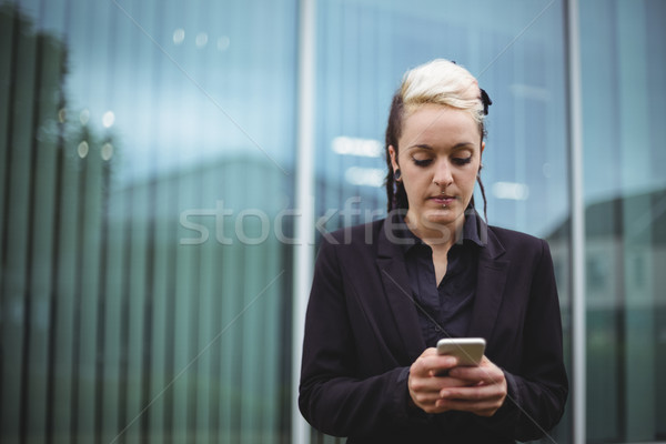 Businesswoman using mobile phone Stock photo © wavebreak_media