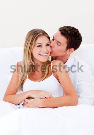 Caring man kissing his laughing wife Stock photo © wavebreak_media