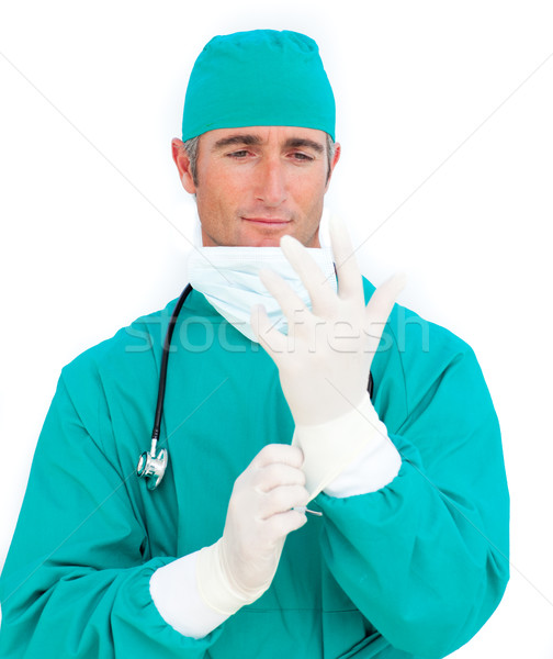 Charming surgeon wearing surgical gloves Stock photo © wavebreak_media