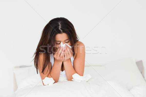 sad woman sitting in bed in bedroom Stock photo © wavebreak_media