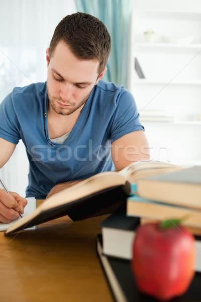 Odaklı erkek öğrenci çalışma kâğıt Stok fotoğraf © wavebreak_media