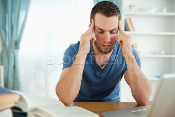 Male student having a hard time finding a proper solution Stock photo © wavebreak_media