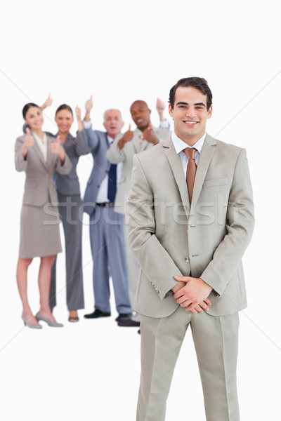 Zâmbitor om de afaceri echipă in spatele alb Imagine de stoc © wavebreak_media