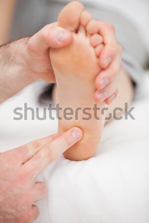 Foot being touched by a thumb in a room Stock photo © wavebreak_media