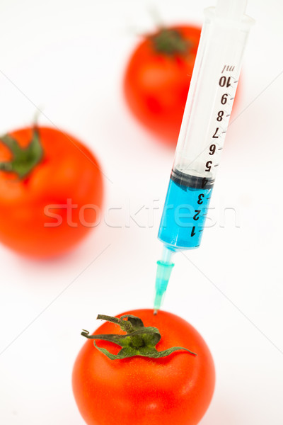 Syringe injecting blue liquid against a white abckground Stock photo © wavebreak_media