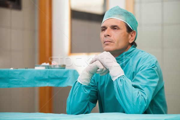 Thoughtful surgeon sitting in a operating theater in a hospital Stock photo © wavebreak_media