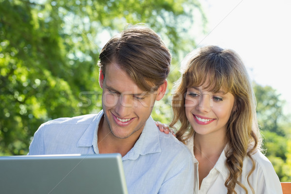 Cute couple séance parc banc ensemble [[stock_photo]] © wavebreak_media