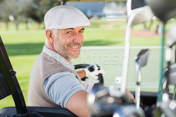 Stockfoto: Gelukkig · golfer · rijden · golf · glimlachend · camera