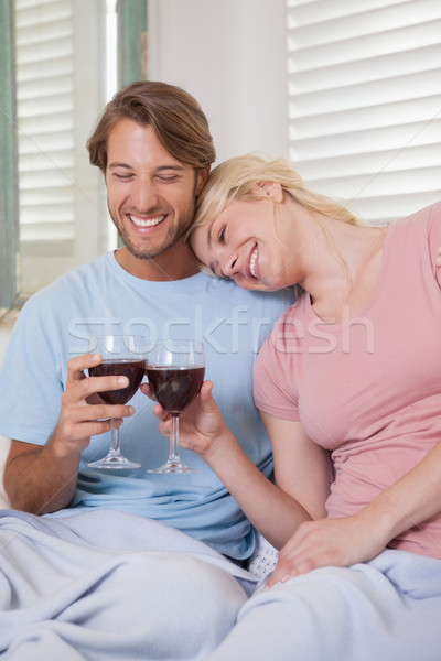Boldog pár ül kanapé vörösbor otthon Stock fotó © wavebreak_media