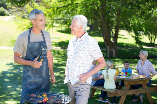 Happy man doing barbecue with his father  Stock photo © wavebreak_media
