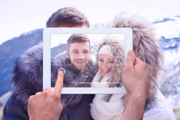 Composite image of hand holding tablet pc Stock photo © wavebreak_media