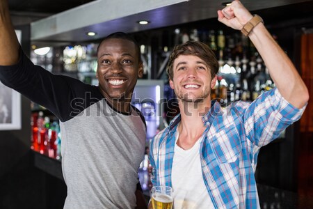 Derűs férfi barátok kar körül áll Stock fotó © wavebreak_media