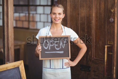 Portrait of waitress holding digital tablet at counter Stock photo © wavebreak_media