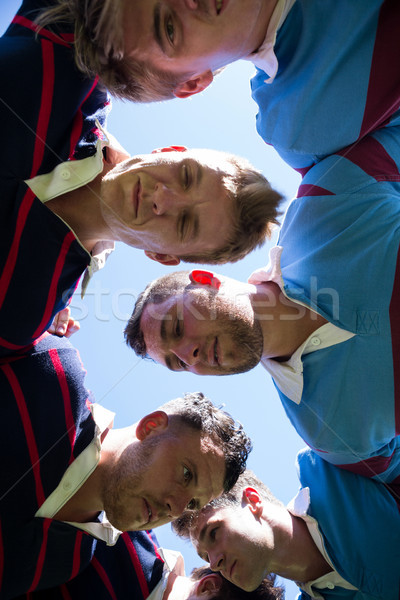 Low angle view of rugby players making huddle Stock photo © wavebreak_media