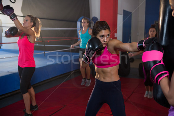 Young female boxers practicing boxing by ring Stock photo © wavebreak_media