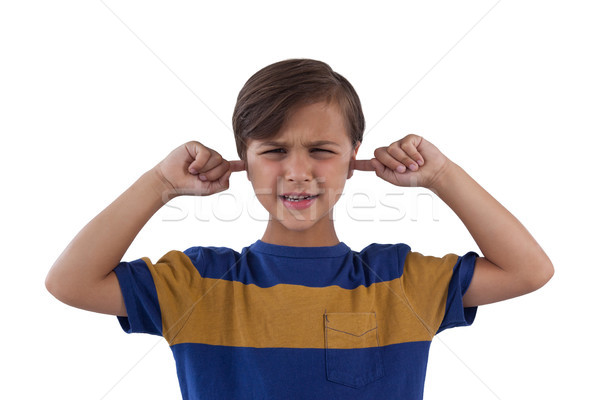 Cute boy covering his ears against white background Stock photo © wavebreak_media