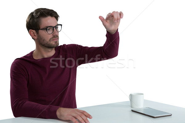 Stock photo: Man pretending to use an invisible screen