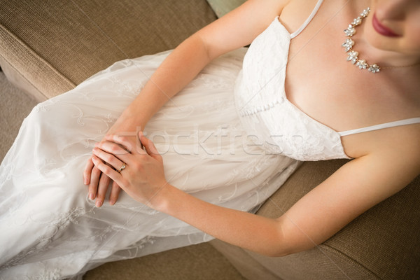 Hermosa novia vestido de novia sesión sofá casa Foto stock © wavebreak_media