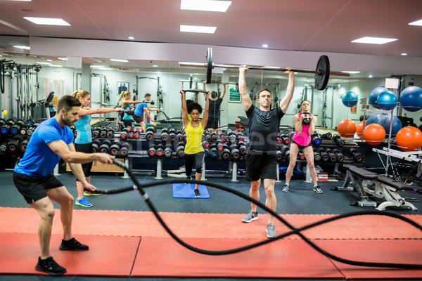 Fit people working out in weights room Stock photo © wavebreak_media