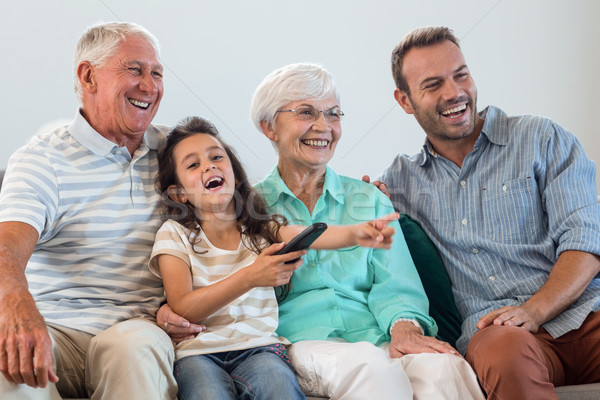 Famille heureuse séance canapé salon homme [[stock_photo]] © wavebreak_media