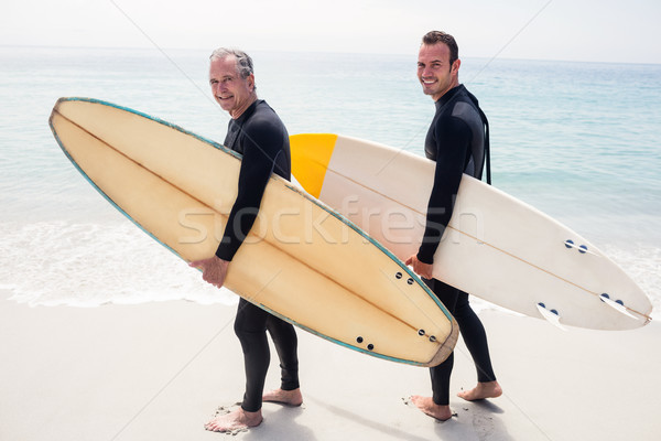 Portré boldog apa fia tart szörfdeszka áll Stock fotó © wavebreak_media