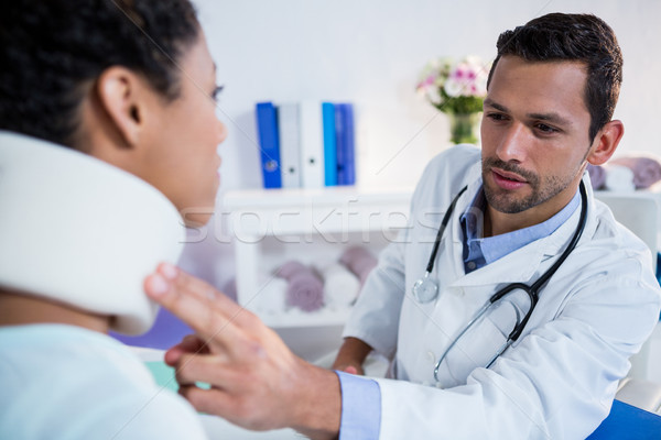 Physiotherapist examining a female patients neck Stock photo © wavebreak_media