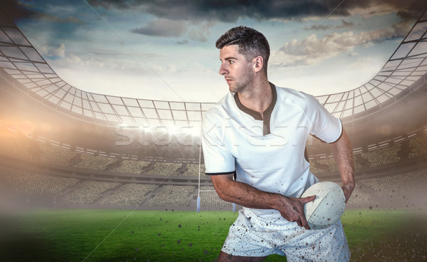 Composite image of rugby player holding the ball aside Stock photo © wavebreak_media
