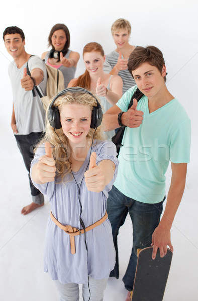 Stock photo: Happy teenagers smiling at the camera