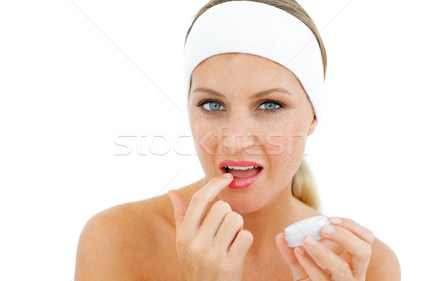 Attractive woman applying lip balm Stock photo © wavebreak_media